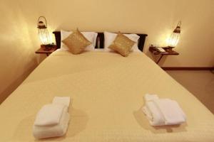Postel nebo postele na pokoji v ubytování Baanmalai Hotel Chiangrai