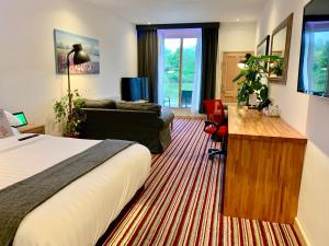 TV a/nebo společenská místnost v ubytování TheWaterfrontLodges