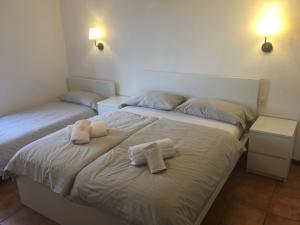 Säng eller sängar i ett rum på Albergo Ristorante Belcantone