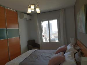 Posteľ alebo postele v izbe v ubytovaní En el cielo de Benidorm - Alteanos V