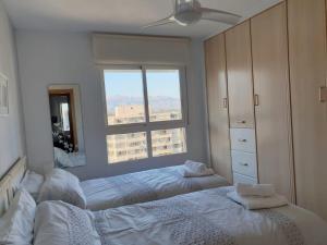 Posteľ alebo postele v izbe v ubytovaní En el cielo de Benidorm - Alteanos V