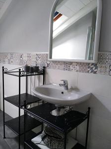 a bathroom with a sink and a mirror at Nel cuore di Stresa in Stresa
