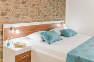Postel nebo postele na pokoji v ubytování Apartments Stella del Mare