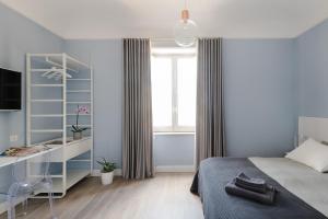 Postel nebo postele na pokoji v ubytování D-Home Ortigia