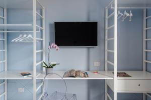 TV a/nebo společenská místnost v ubytování D-Home Ortigia