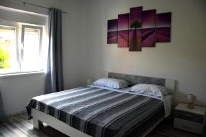 Postel nebo postele na pokoji v ubytování Apartman Ana