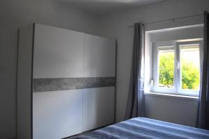 Postel nebo postele na pokoji v ubytování Apartman Ana