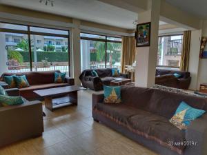a large living room with couches and a table at Maricosta Apartments in Protaras