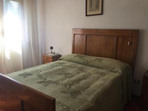 A bed or beds in a room at Villa Romolina