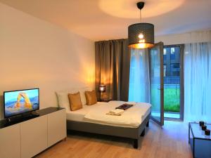 Postel nebo postele na pokoji v ubytování Prima Family Apartments