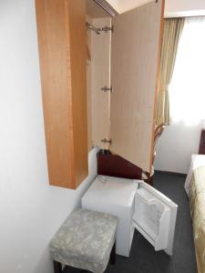 Postel nebo postele na pokoji v ubytování Niigata Terminal Hotel