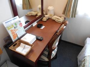 Postel nebo postele na pokoji v ubytování Niigata Terminal Hotel