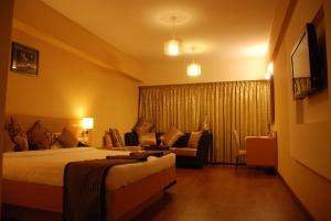 Un pat sau paturi într-o cameră la PLA Krishna Inn