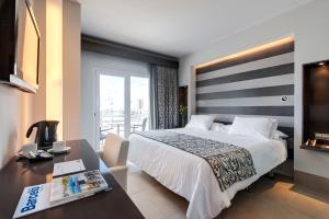Voodi või voodid majutusasutuse Barceló Hamilton Menorca - Adults Only toas