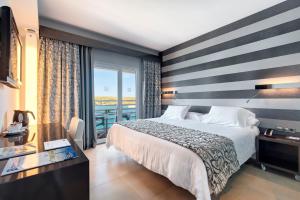 Voodi või voodid majutusasutuse Barceló Hamilton Menorca - Adults Only toas