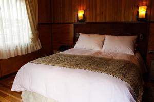Postel nebo postele na pokoji v ubytování Hotel Aliwen