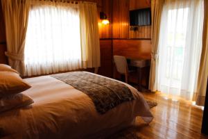 Postel nebo postele na pokoji v ubytování Hotel Aliwen