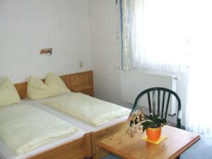 Ένα ή περισσότερα κρεβάτια σε δωμάτιο στο Gasthof Steinerwirt