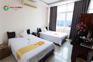 Giường trong phòng chung tại Hong phuc Hotel