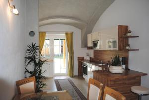 Kuchyň nebo kuchyňský kout v ubytování Gartler's Appartements