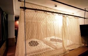 Una cama o camas en una habitación de 台南謝宅 Old House Inn