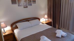 Posteľ alebo postele v izbe v ubytovaní White Apartment 70m from the sea