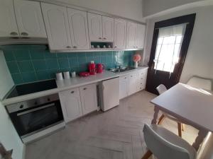 Kuchyň nebo kuchyňský kout v ubytování Amaryllis + 15 fotografií