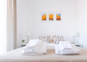 Ένα ή περισσότερα κρεβάτια σε δωμάτιο στο The Yellow House Cascais