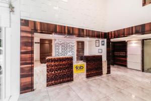 a wine tasting room with wooden walls and wine racks at Hotel Summit in Ahmedabad