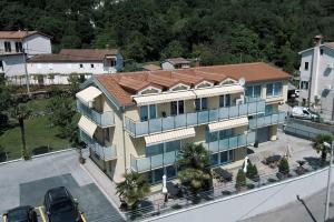 an aerial view of a large building with a parking lot at Villa Martina in Ika
