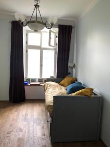 a living room with a couch and a window at Lõuna 6-3 Apartement in Pärnu