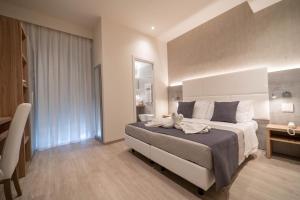Postel nebo postele na pokoji v ubytování Hotel Reggiana + 29 fotografií