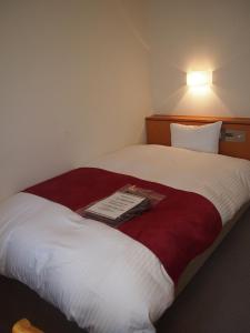 Krevet ili kreveti u jedinici u objektu Hotel Taisei Annex