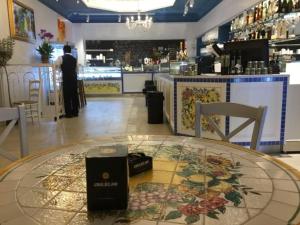 a restaurant with a table with a book on it at Vatican Planet in Rome