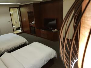 TV a/nebo společenská místnost v ubytování Sun Sweet Hotel