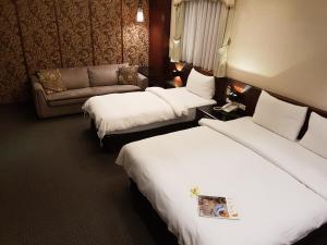 Postel nebo postele na pokoji v ubytování Sun Sweet Hotel