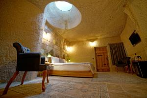 Postel nebo postele na pokoji v ubytování Design Cave Hotel