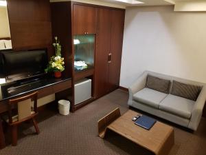TV a/nebo společenská místnost v ubytování Sun Sweet Hotel