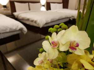 Postel nebo postele na pokoji v ubytování Sun Sweet Hotel
