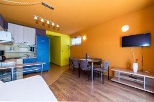 a room with a kitchen and a dining room at Villa Gorica Apartments Ražanj in Ražanj