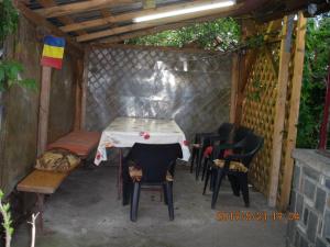 a tent with a table and chairs in it at Vila Mihaela in Breaza