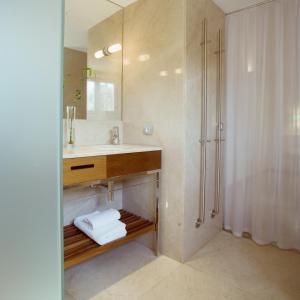 a bathroom with a sink and a shower at Petit Palace Hotel Tres in Palma de Mallorca