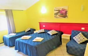 Postel nebo postele na pokoji v ubytování Fanti Rooms
