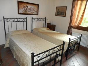 A bed or beds in a room at Ca' Bianca