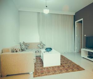 A television and/or entertainment centre at Pool View One bedroom Apt - B103