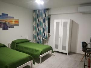 Łóżko lub łóżka w pokoju w obiekcie Casa Mia