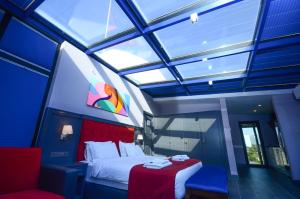 Postel nebo postele na pokoji v ubytování Batumi Palm Hotel