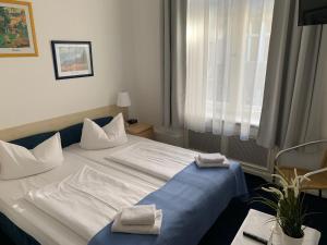Säng eller sängar i ett rum på Hotel Seifert Berlin am Kurfürstendamm