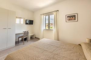 Postel nebo postele na pokoji v ubytování L'Antico Borgo B&B