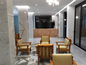 a meeting room with chairs and a table in a lobby at Catherine Hotel in Kos